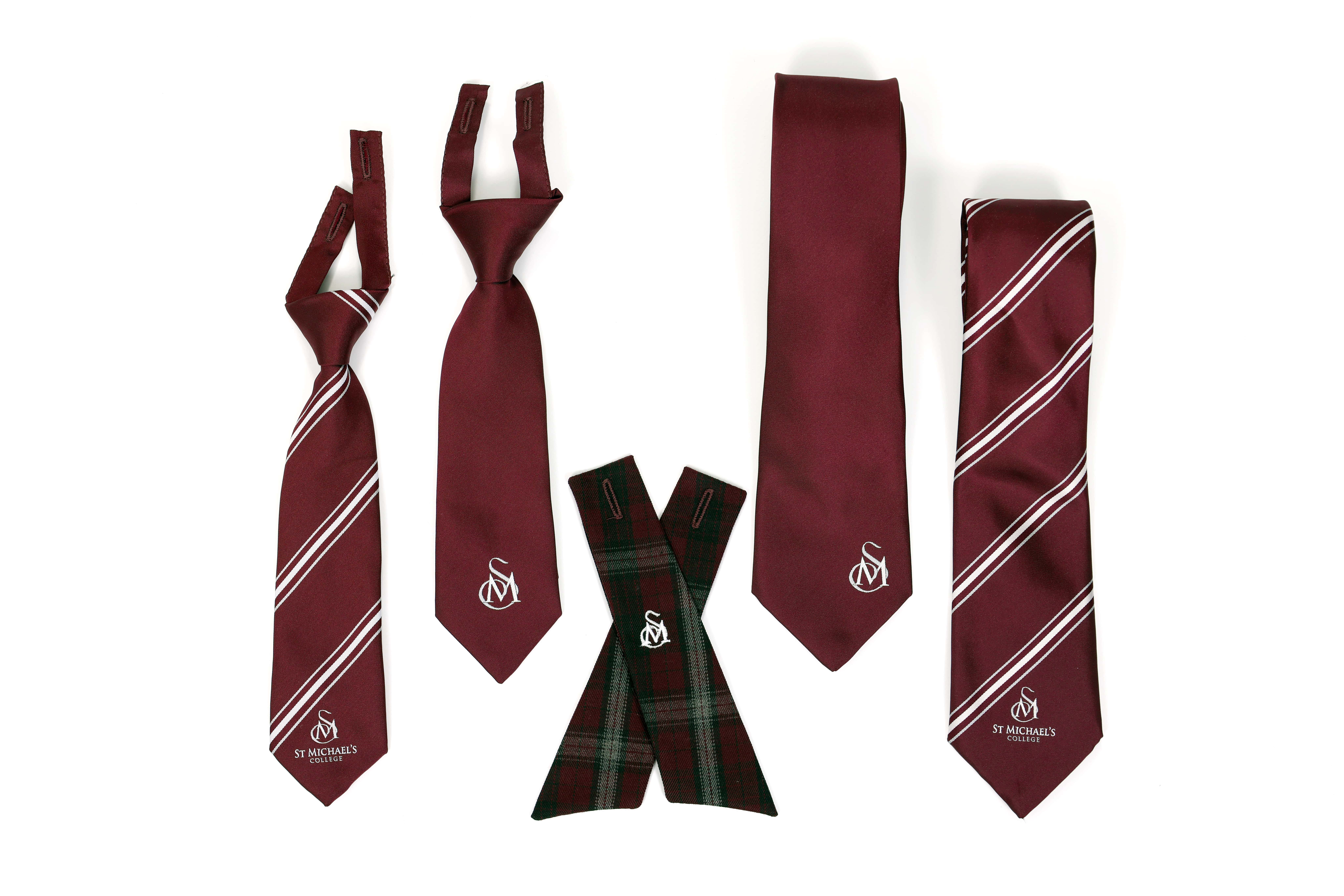 St Michael’s College ties in maroon and striped designs arranged to show different styles and fastening options